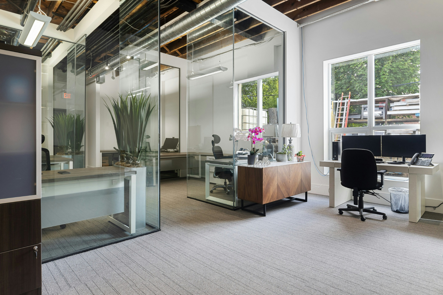 VitalCare occupational health office with glass consultation rooms and natural light